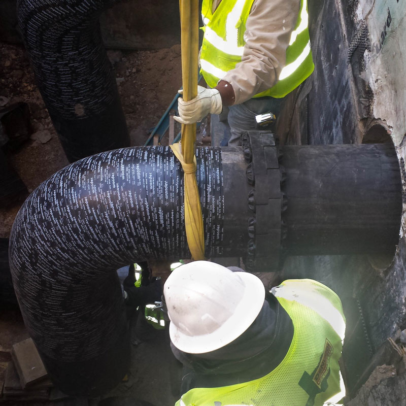 men working on pipes